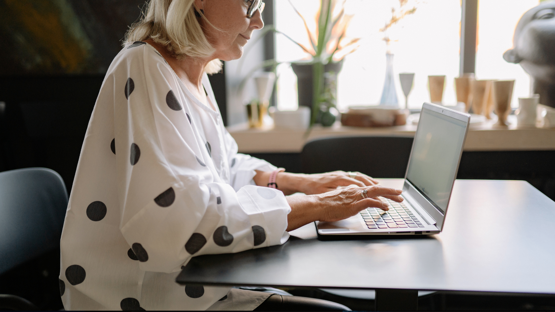 Beginner typist practicing on a laptop in a bright, calm workspace